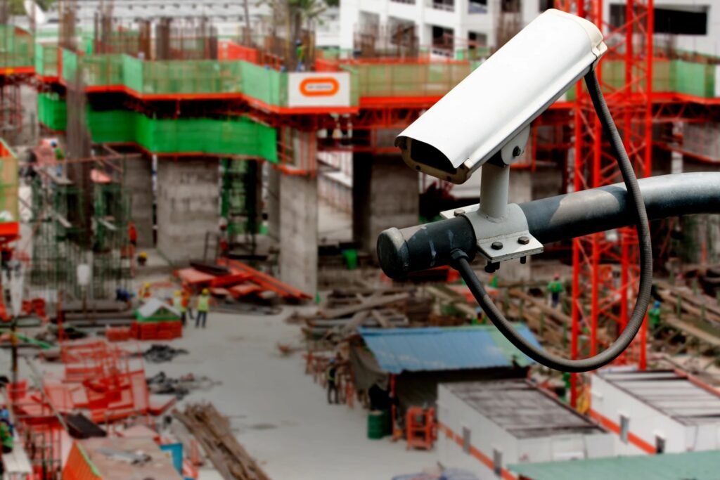 Outdoor CCTV camera installed at a construction site, overseeing workers and equipment.